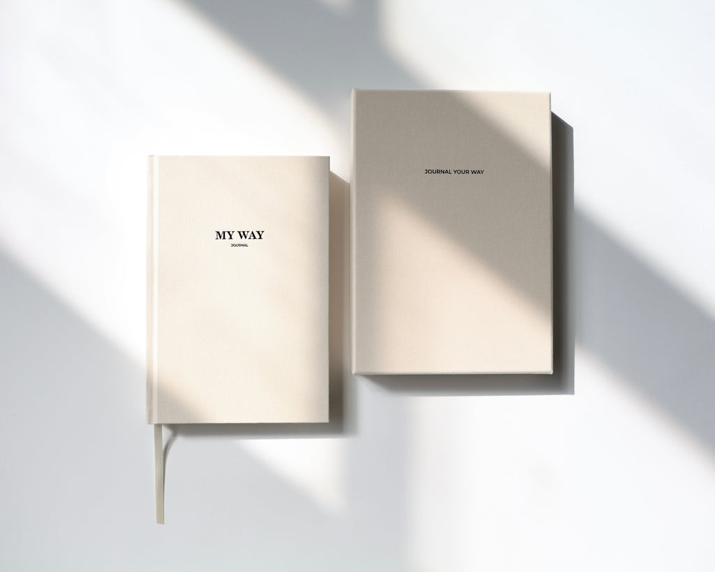 Beige linen My Way Journal and matching premium gift box on a minimal white background with soft natural sunlight, undated planner and reflection journal set.